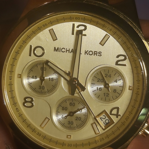Gold Michael Kors women\'s wrist watch